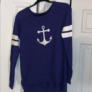 Purple sweater with white colored anchor